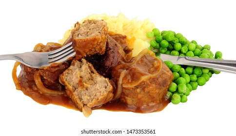 Pork faggot meal with mashed potatoes and peas isolated on a white background