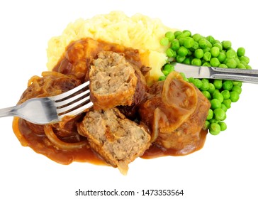 Pork faggot meal with mashed potatoes and peas isolated on a white background