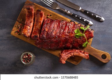 Pork Loin Ribs Served On Chopping Board. View From Above, Top