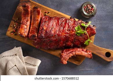 Pork Loin Ribs Served On Chopping Board. View From Above, Top