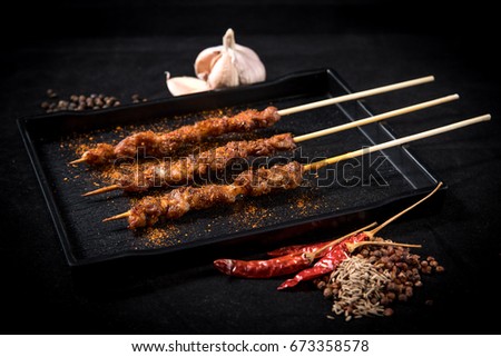 pork mala grilled on table with blackground (selective focusing)