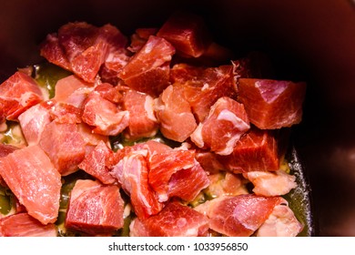 Pork meat preparing in the slow cooker - Shutterstock ID 1033956850