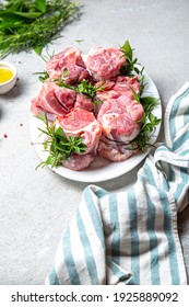 Pork Osso Buco, Shin Pork Shanks With Fresh Aromatic Herbs On White Marmol Board