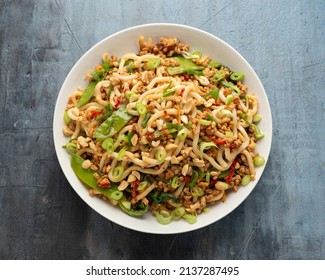 Pork, Peanut Udon Noodles With Pak Choi, Mangetout And Red Chili. Asian Food