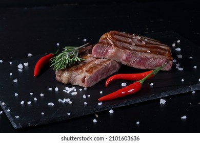 Pork Ribeye Steak. Grilled Steak On Black Background