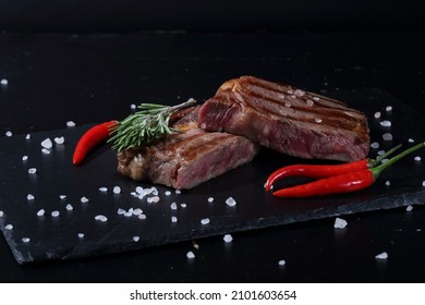 Pork Ribeye Steak. Grilled Steak On Black Background