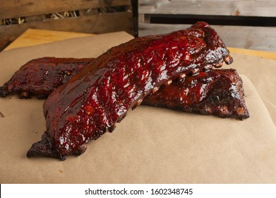 Pork Ribs, Barbecue Style. Classic Traditional Texas Smokehouse Favorite Menu Item: Baby Back Pork Ribs. Slow Cooked In Seasoned Smoker Over Mesquite Wood Chips Covered In Homemade Bbq Sauce. 