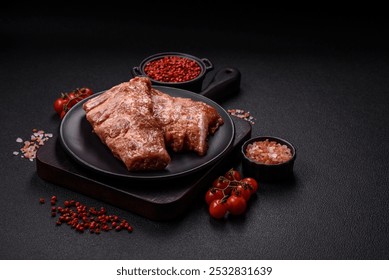 Pork ribs in sweet and sour sauce with salt, spices and herbs prepared for grilling - Powered by Shutterstock