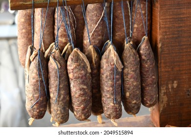 Pork Sausages Hanging From A Market Stall In Corsica