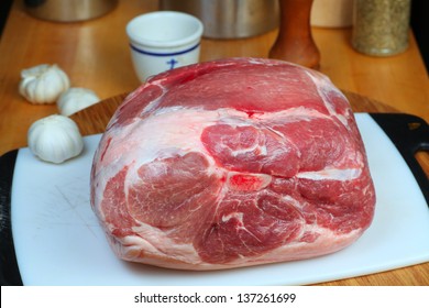 Pork Shoulder/Boston Butt On Cutting Board Prior To Trimming For Slow Roast Into Pulled Pork