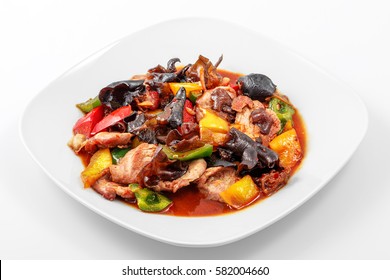 Pork, Sichuan Sauce, Pepper, Garlic, Chinese Wood Mushrooms In A White Plate On A White Background