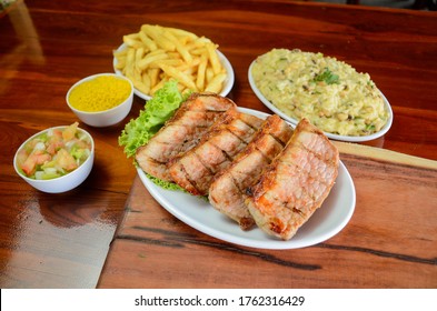 Pork Steak With Baião De Dois And Fries