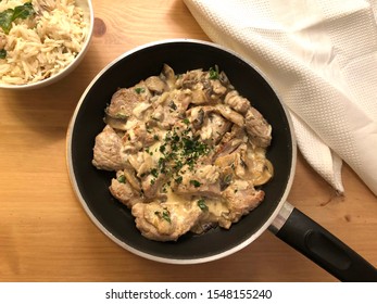 Pork Tenderloin In Creamy Mushroom Sauce With Rice.