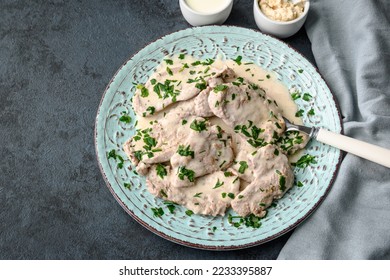 Pork tenderloin in horseradish and cream sauce - Shutterstock ID 2233395887