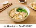 pork wonton soup or pork dumplings soup with vegetable - Asian food style