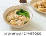 pork wonton soup or pork dumplings soup with vegetable - Asian food style