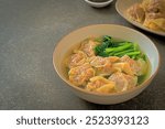 pork wonton soup or pork dumplings soup with vegetable - Asian food style