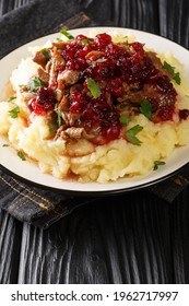 Poronkaristys Sauteed Reindeer, Mashed Potatoes And Lingonberries Close-up In A Plate On The Table. Vertical
