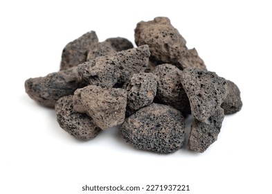 Porous black volcanic rock isolated on white background. Lava stone, pumice stone, or volcanic pumice with distinctive pores. Isolated on white background.