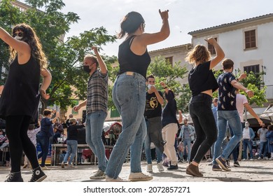 Porreres, Spain; october 31 2021: Annual autumn fair in the Majorcan town of Porreres, held on October 31. People dancing the folkloric dance of MAllorca, Ball de Bot in the street. New normal