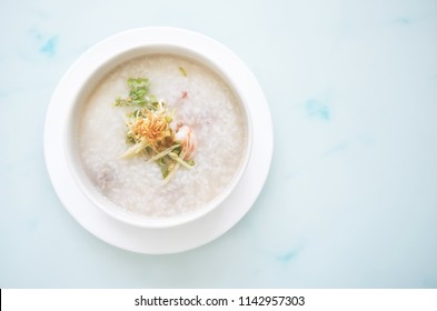 Porridge Rice With Shrimp In White Bowl. Top View Photo