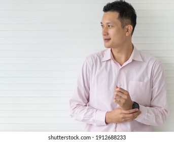 Porrtrait of yound smile face Asian man in casual shirt.