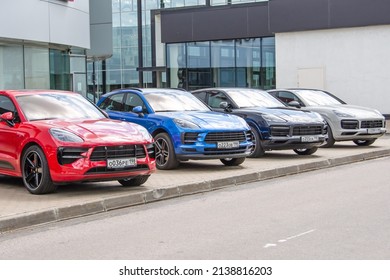 Porsche car different classes of machine models near to an authorized dealer, porsche showroom. Russia, Saint-Petersburg, 27 may 2021