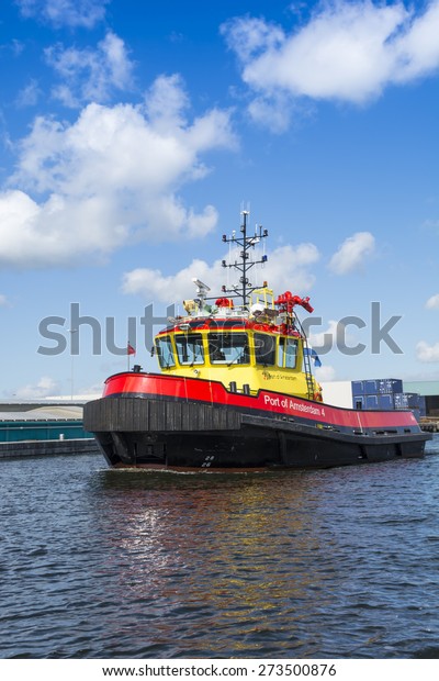 Port of Amsterdam, Noord-Holland/Netherlands - April\
28-04-2015 - Vessel Port of Amsterdam 4 is sailing in port and is\
on duty. The port authorities always check the different activity\'s\
in port. 