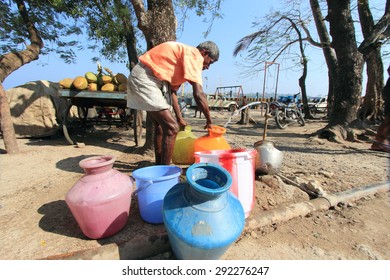 PORT BLAIR, INDIA - FEB 13: An Unidentified Man Collects Drinking Water From Public Tap On February 13, 2012 In Port Blair, Andamans,India. Andamans Being An Island Faces Acute Drinking Water Shortage