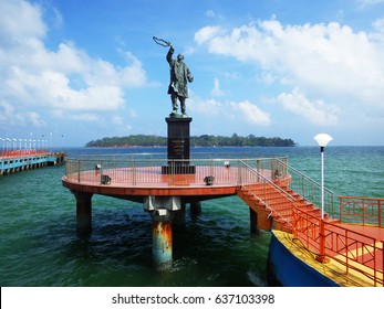 PORT BLAIR, INDIA - March 14, 2013: Statue Of  Rajiv Gandhi (Youngest Indian Prime Minister) At Water Sports Complex With Ross Island In Background, Port Blair, Andaman And Nicobar Islands, India