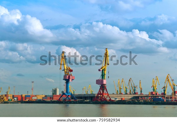 Port cranes. Port terminal\
logistics. Freight cars to the river or sea port. Kaliningrad,\
Russia