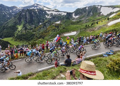 PORT DE PAILLERES,FRANCE- JUL 6: The peloton climbing the road to Col de Pailheres in Pyrenees Mountains during the stage 8 of the 100 edition of Le Tour de France on July 6, 2013