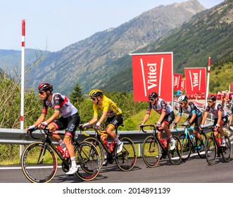 Port d'Envalira, France - July 11,2021: The Slovenian cyclist Tadej Pogacar of UAE Emirates Team, in Yellow Jersey climbing the road to  Port d'Envalira during Le Tour de France 2021.
