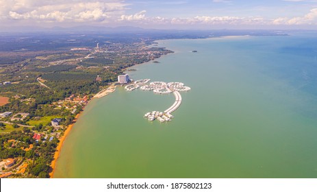 Port Dickson, Malaysia - December 12, 2020: Aerial view of the Lexis Hibiscus Hotel at the Blue Lagoon. The hotel in the shape of a hibiscus flower. Off shore the west coast in the street of Malacca