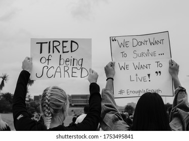 Port Elizabeth, South Africa - March 2019: Two Young Women Holding Up Banners At A Protest To Remember Women Who Were Raped And Killed In South Africa.