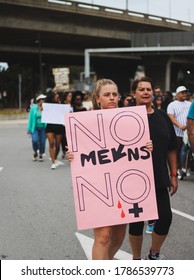 Port Elizabeth, South Africa - September 2019: A Young Woman Holding A Sign That Says 