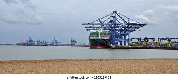 Port Of Felixstowe, Suffolk, United Kingdom, September 21, 2022. Large Bulk Carrier Container Ship In Dock. Being Loaded By Cranes. Illustrates International Trade, Economic Growth, Globalisation