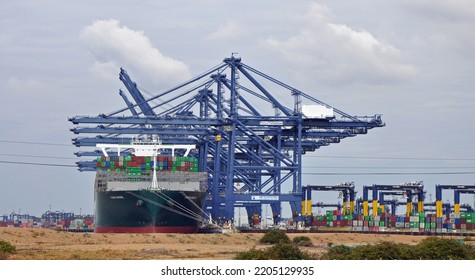 Port Of Felixstowe, Suffolk, United Kingdom, September 21, 2022. Large Bulk Carrier Container Ship In Dock. Being Loaded By Cranes. Illustrates International Trade, Economic Growth, Globalisation