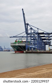 Port Of Felixstowe, Suffolk, United Kingdom, September 21, 2022. Large Bulk Carrier Container Ship In Dock. Being Loaded By Cranes. Illustrates International Trade, Economic Growth, Globalisation