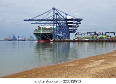 Port Of Felixstowe, Suffolk, United Kingdom, September 21, 2022. Large Bulk Carrier Container Ship In Dock. Being Loaded By Cranes. Illustrates International Trade, Economic Growth, Globalisation