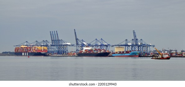 Port Of Felixstowe, Suffolk, United Kingdom, September 21, 2022. Large Bulk Carrier Container Ship In Dock. Being Loaded By Cranes. Illustrates International Trade, Economic Growth, Globalisation