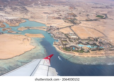 Port Ghalib, Egypt - 03 02 2019: The view from the plane to the small tourist paradise Porto Ghalib and Sahara desert in Egypt.