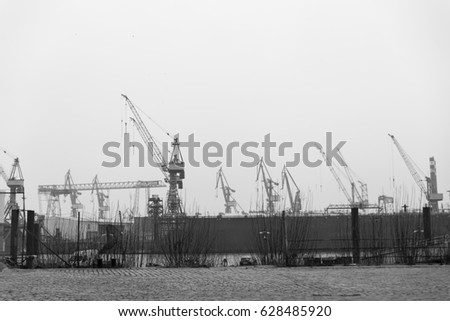 Similar – Pastel evening atmosphere at the harbor basin with cargo cranes