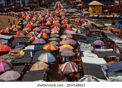 Port Harcourt, Nigeria - November 10, 2020: Mile I Market, A Crowded Marketplace In Port Harcourt City With Structures Consisting Mostly Of Colourful Umbrellas Serving As Shade And Space For Traders.