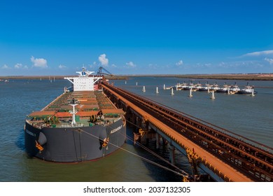 Port Hedland, Australia - March 9, 2021: A Fully-loaded Ship With Iron Ore In Port Hedland, Australia.