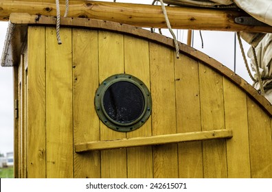A Port Hole On An Old Wooden Ship