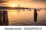 Port Jefferson, New York marina at sunset. Port Jefferson was settled in the 17th century and remained a rural community until its development as a shipbuilding center in the mid 19th century.