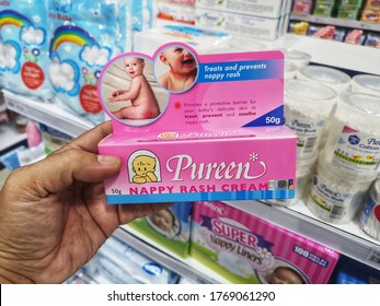 Port Klang, Malaysia - 25 June 2020 : Hand Hold A PUREEN Nappy Rash Cream For Sell In Supermarket With Selective Focus.