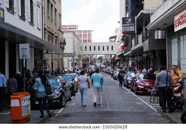 Port Louis, Mauritius - August 16, 2018: Street\
life of Port Louis on August 16, 2018 in Port Louis, Mauritius.\
Mauritius is a religiously diverse nation, it is a secular state\
and freedom of religion