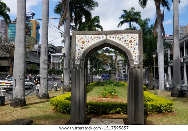 Port Louis, Mauritius - August 16, 2018: A small\
decorated arch at center of Port Louis, capital city of Mauritius.\
Port Louis is the country\'s economic, cultural, political centre\
and most populous c